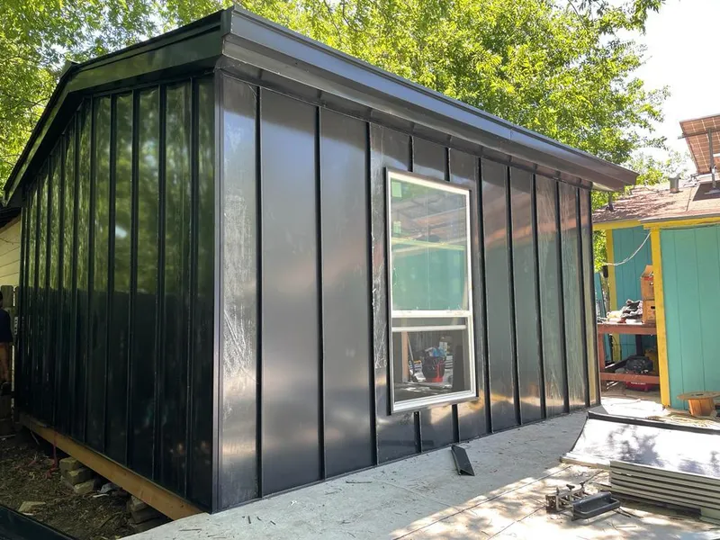 Black standing seam metal wall panels for Roof Inspection in Naperville