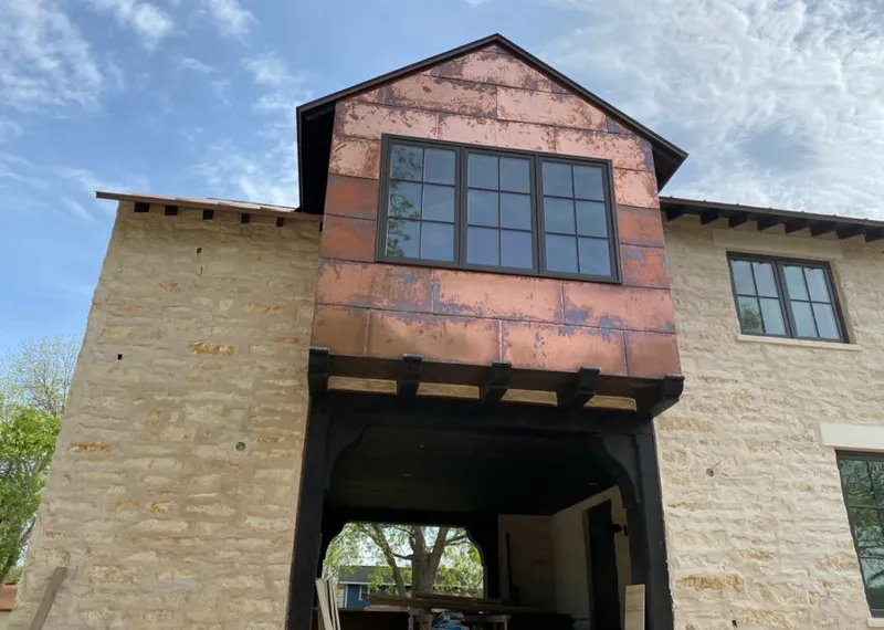 Copper metal panel facade on a stone building for Metal Roof Coating in Naperville
