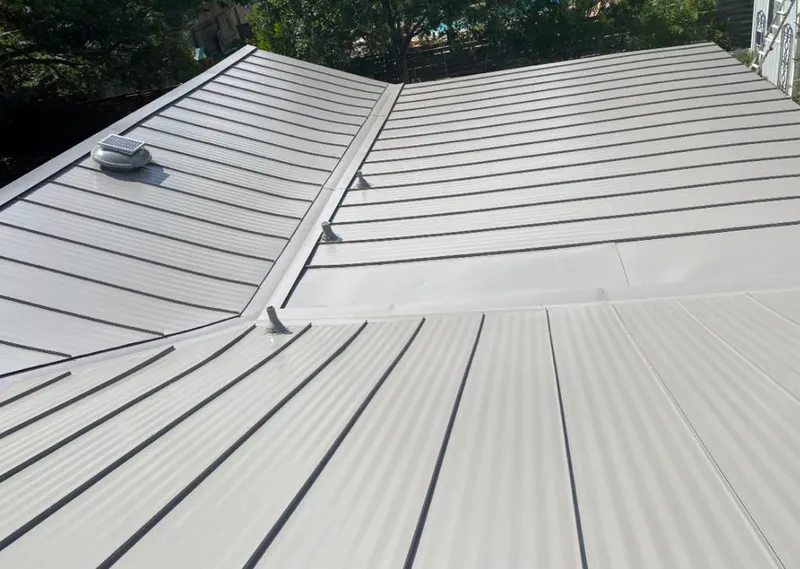 Solar attic fan installed on a metal roof for Roof Ventilation in Naperville